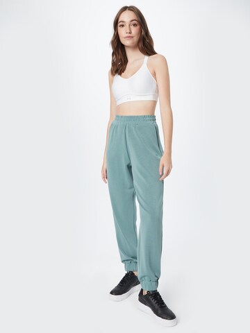 Effilé Pantalon de sport 4F en bleu