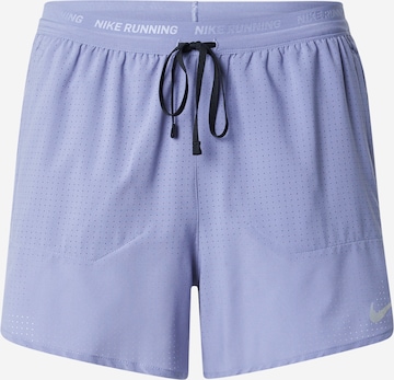 Pantalon de sport 'STRIDE' NIKE en bleu : devant