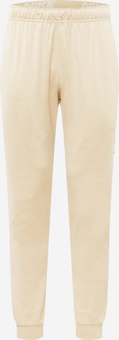 NIKE Workout Pants in Beige: front