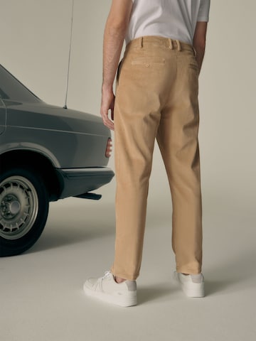 ABOUT YOU x Alvaro Soler Regular Pleat-Front Pants 'Fiete' in Beige