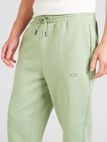 OAKLEY Tapered Sportbroek 'RELAX 2.0' in Groen