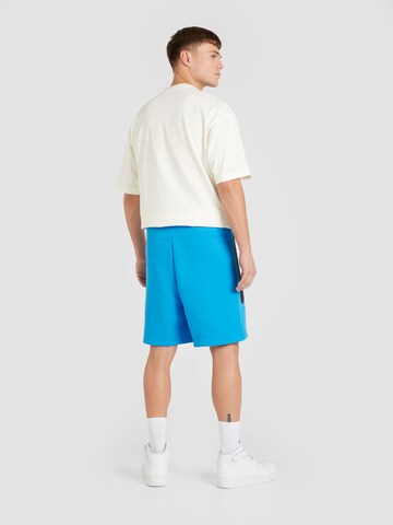 Loosefit Pantaloni de la Nike Sportswear pe albastru