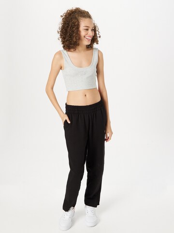 PUMA - Loosefit Pantalón deportivo 'Her' en negro