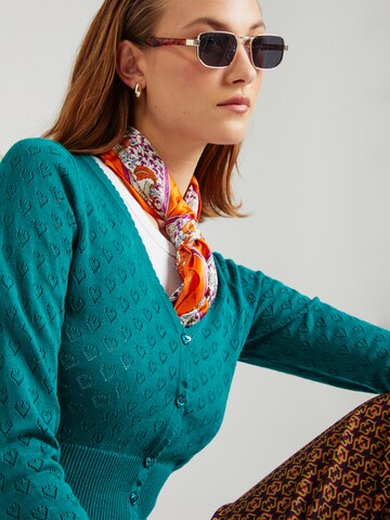 Cardigan King Louie en vert