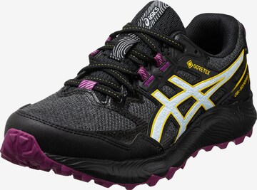 Chaussure de course ASICS en noir : devant