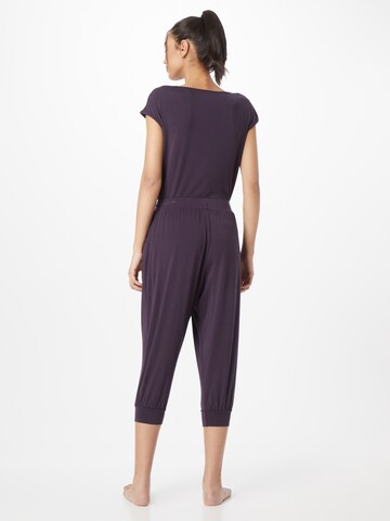 CURARE Yogawear Zwężany krój Spodnie sportowe w kolorze fioletowy