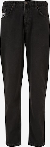 Karl Kani Tapered Jeans in Black: front