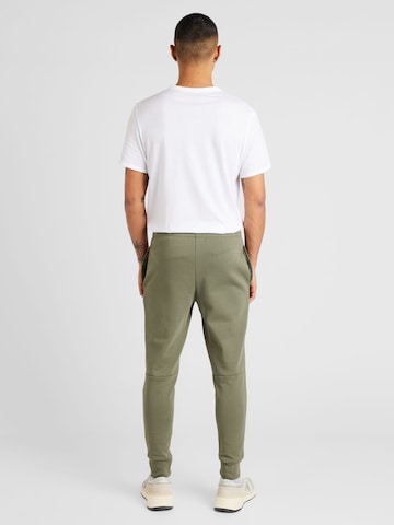 Slimfit Pantaloni de la LACOSTE pe verde