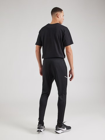 NIKE Tapered Sportbroek in Zwart