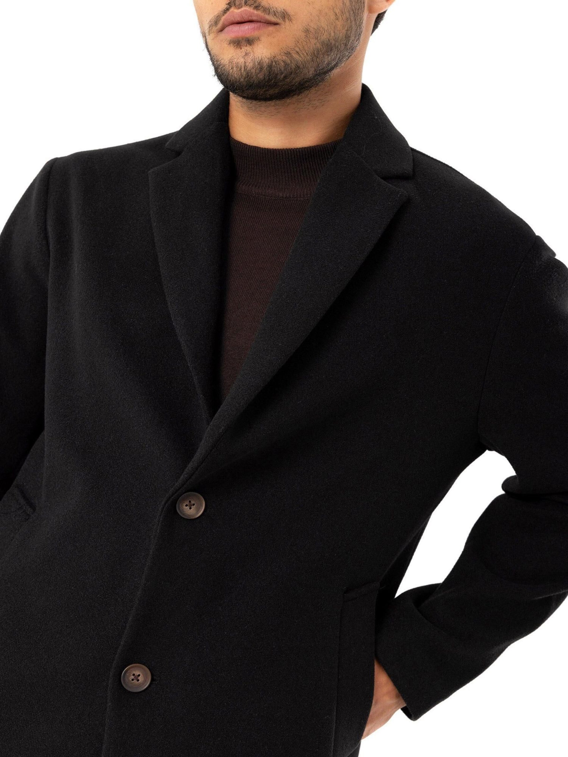 Antioch Välikausitakki värissä musta