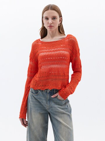 Pull-over OXXO en orange : devant