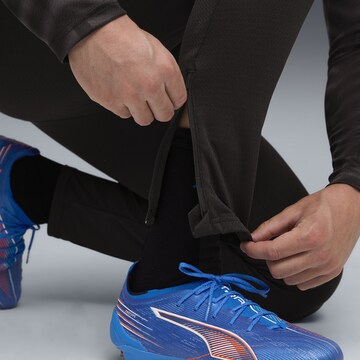 Coupe slim Pantalon de sport 'IndividualCUP' PUMA en noir