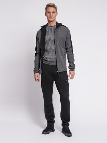 Hummel Regular Sports trousers in Black