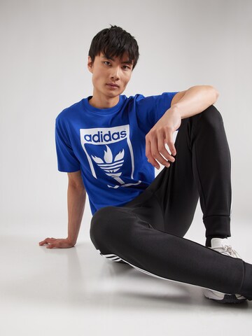 ADIDAS ORIGINALSMajica 'Trefoil Torch' - plava boja