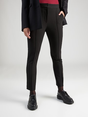 Coupe slim Pantalon à plis TOMMY HILFIGER en noir : devant