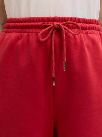 EDITED Regular Sports trousers 'Una' in Red