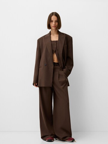 Bershka Loose fit Pleat-front trousers in Brown