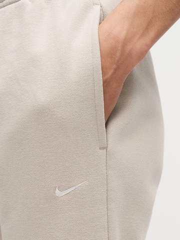 Tapered Pantaloni de la Nike Sportswear pe bej