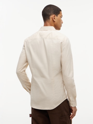 Tommy Jeans Slim fit Koszula w kolorze beżowy