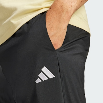 ADIDAS SPORTSWEAR Zwężany krój Spodnie sportowe 'Essentials' w kolorze czarny