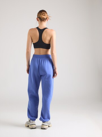 Tapered Pantaloni 'Phoenix Fleece' de la Nike Sportswear pe albastru
