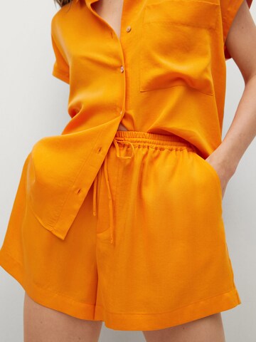 MANGO Loose fit Pants 'LIM' in Orange