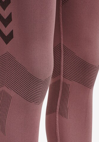 Hummel Skinny Spodnie sportowe 'First' w kolorze różowy