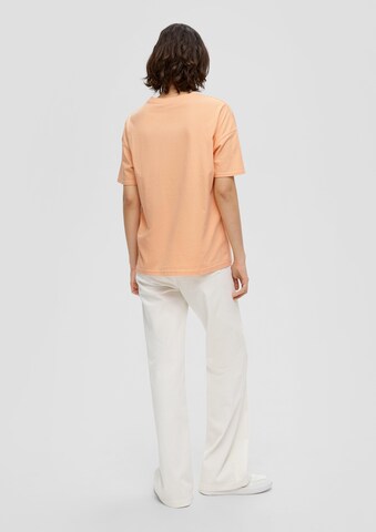 QS - Camiseta en naranja: atrás