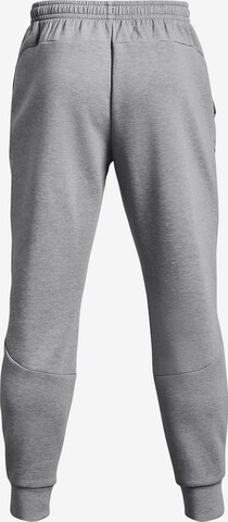 Effilé Pantalon de sport 'Unstoppable' UNDER ARMOUR en gris
