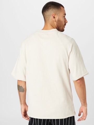 T-Shirt Karl Kani en beige