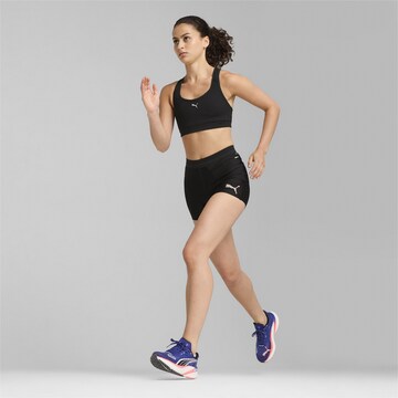 PUMA Skinny Sports trousers in Black
