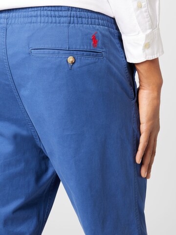Polo Ralph Lauren Bootcut Bukse 'PREPSTERP' i blå