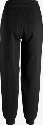 PUMA - Tapered Pantalón deportivo 'Her' en negro