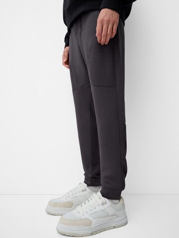 Bershka Tapered Bukser i grå