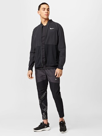 NIKE Trainingsjack in Zwart