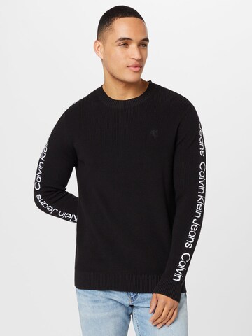 Pull-over Calvin Klein Jeans en noir : devant