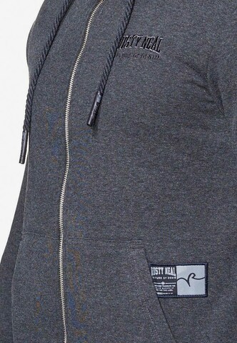 Rusty Neal Zip-Up Hoodie in Grey