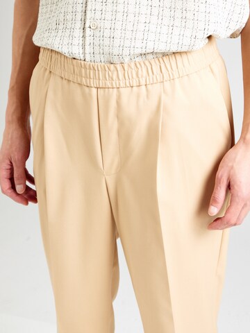 TOPMAN Zwężany krój Cygaretki w kolorze beżowy