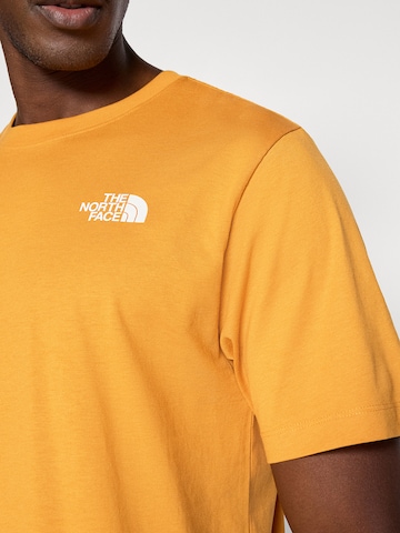 THE NORTH FACE Μπλουζάκι 'EVOLUTION BOX NSE' σε πορτοκαλί