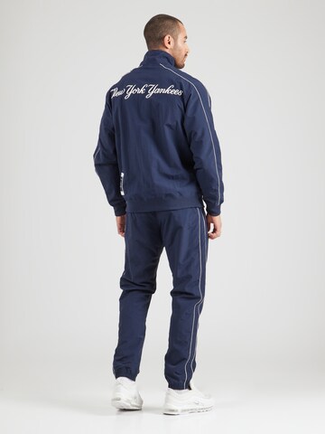 Champion Authentic Athletic Apparel Tracksuit in Blue