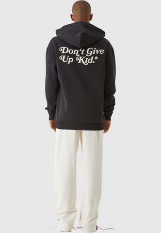 9N1M SENSE - Sudadera 'Don't Give Up Kid' en negro