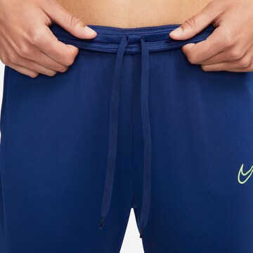NIKE Slim fit Workout Pants 'Academy Winter' in Blue