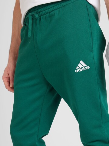 ADIDAS SPORTSWEAR Tapered Urheiluhousut 'Essentials' värissä vihreä