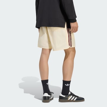 ADIDAS ORIGINALS - Regular Calças 'Sprinter' em amarelo