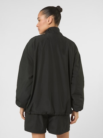 FILA - Sudadera con cremallera 'CASANO oversized contrast piping anorak' en negro
