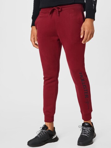 HOLLISTER - Tapered Calças em vermelho: frente