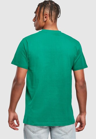 T-Shirt 'Never On Time' Merchcode en vert