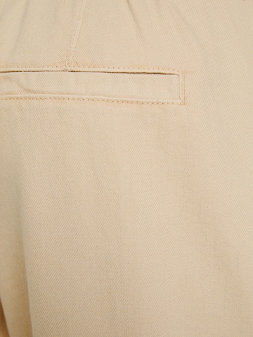 Bershka Tapered Jeans med lægfolder i beige