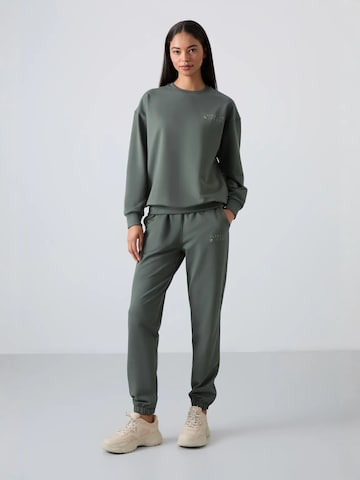 Tuta da jogging di Tommy Life in verde: frontale