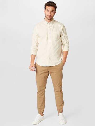 TOM TAILOR DENIM Tapered Broek in Beige